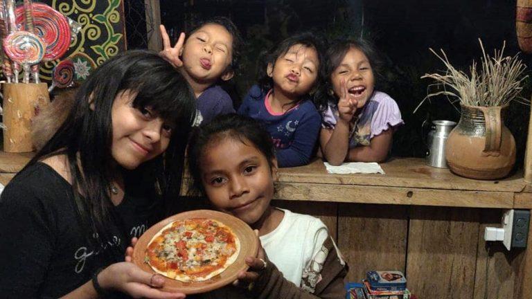 Kids enjoying Food from microcredit financed booth